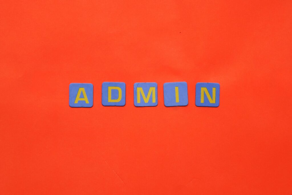 Vibrant display of 'ADMIN' text on a bright red surface.